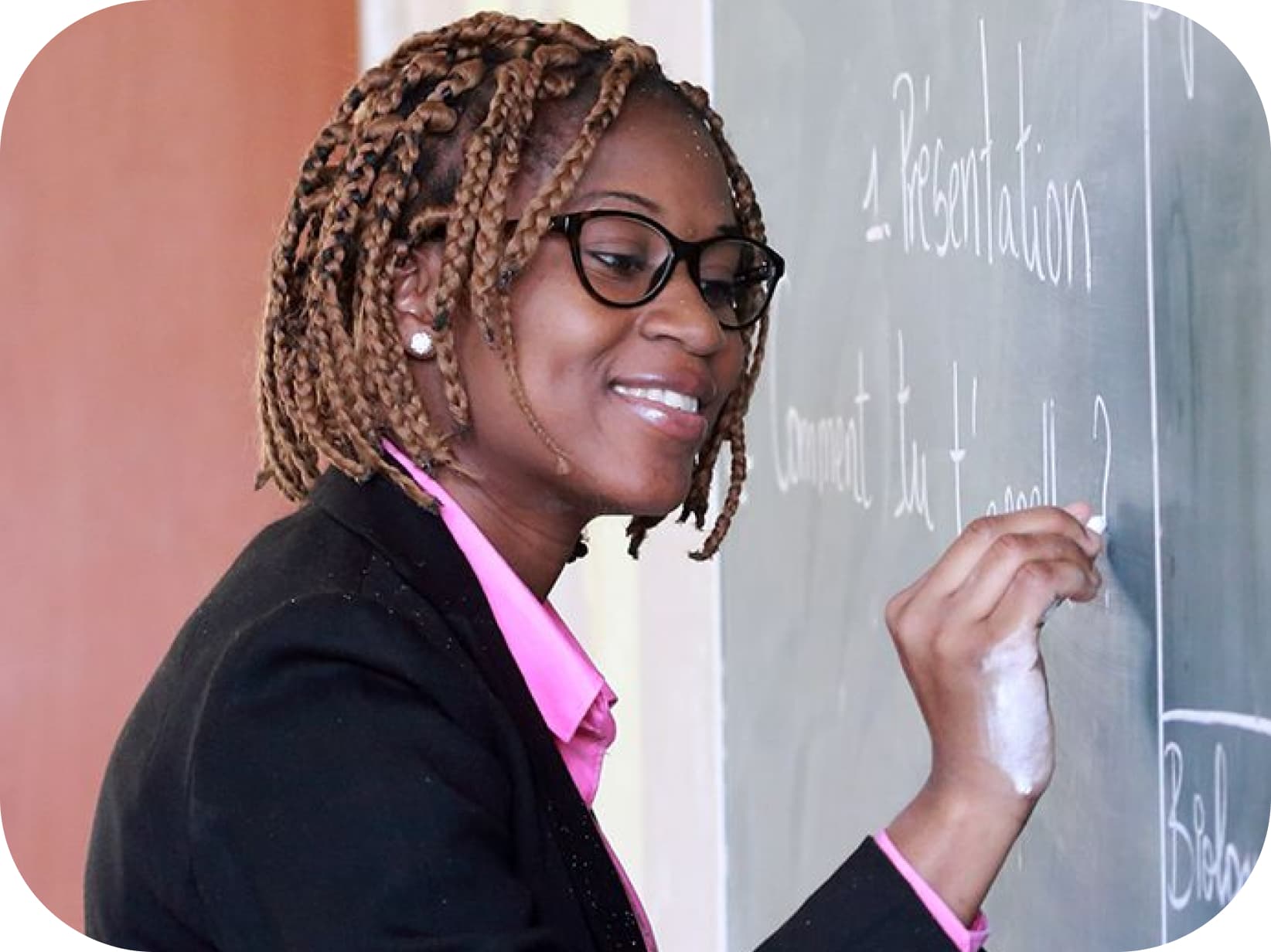 Teacher writing on a chalkboard
